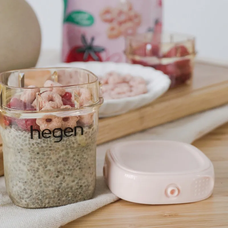 Chia seed pudding in a small glass, topped with fruit and rice puffs
